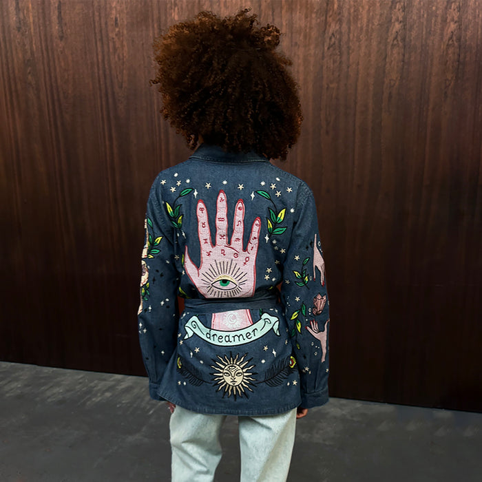 Denim Manifestation Jacket with colourful tarot-inspired embroidery and a dreamer motif on blue cotton denim.
