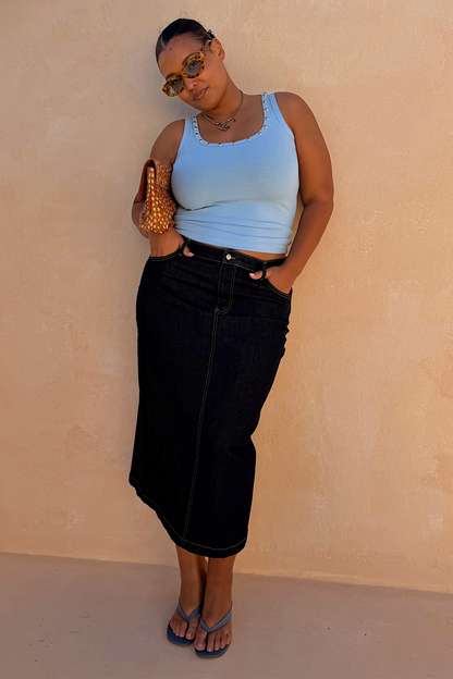 Dark blue Denim Pencil Skirt with contrast stitching, styled with a light blue tank top on a curve model.