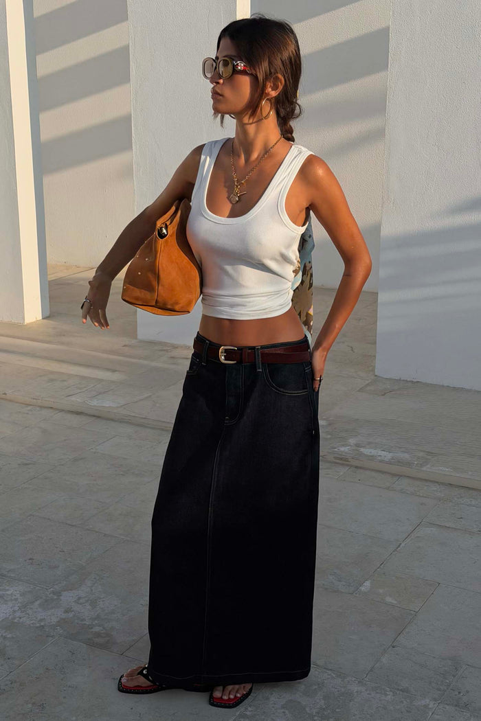 Dark blue Denim Pencil Skirt with a button fastening, styled with a white vest tank and brown suede accessories.