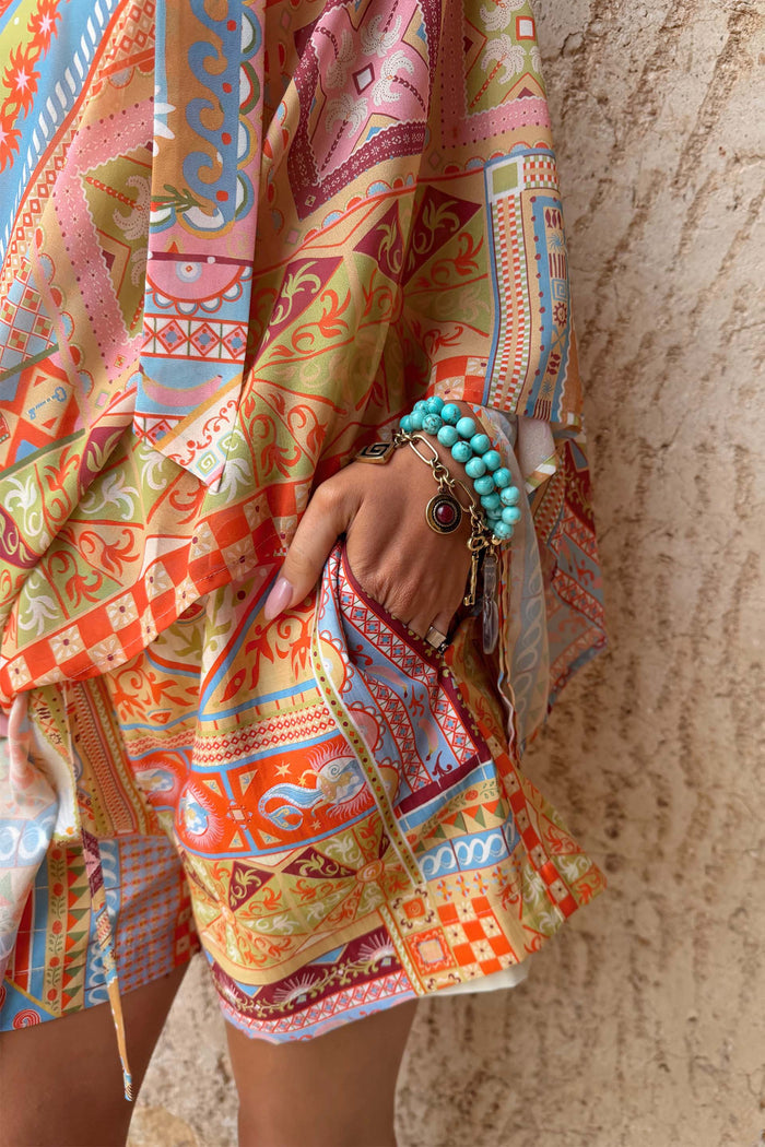 Dolce Vita Ellie Shorts in a tile patchwork print with side pockets, styled as a matching co-ord.