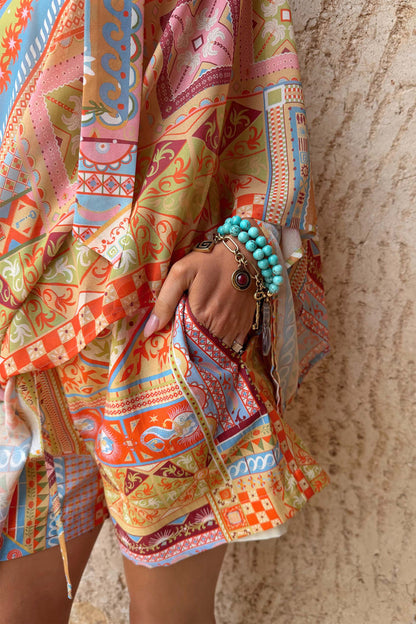 Dolce Vita Ellie Shorts in a tile patchwork print with side pockets, styled as a matching co-ord.