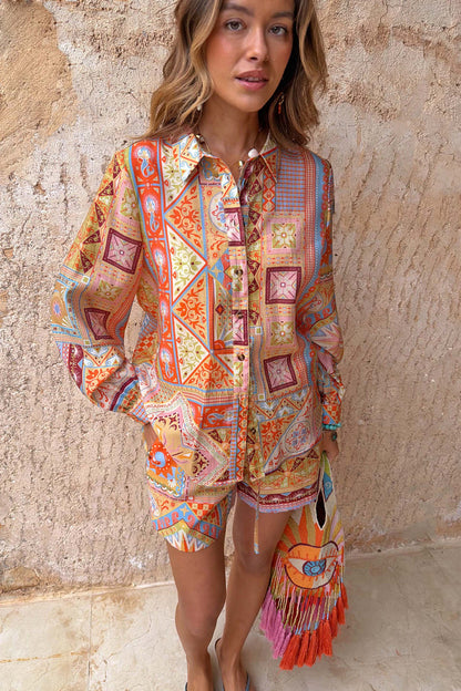 Dolce Vita Ellie Shorts in a colourful tile patchwork print, styled with a matching shirt for a co-ord look.