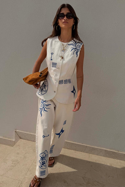 Dolce Vita ecru denim waistcoat featuring blue sun embroidery, styled with matching co-ord barrel leg jeans.