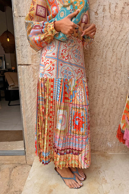 Pleated Dolce Vita Freya Skirt in a colourful tile patchwork print with an asymmetric yoke, designed in London.