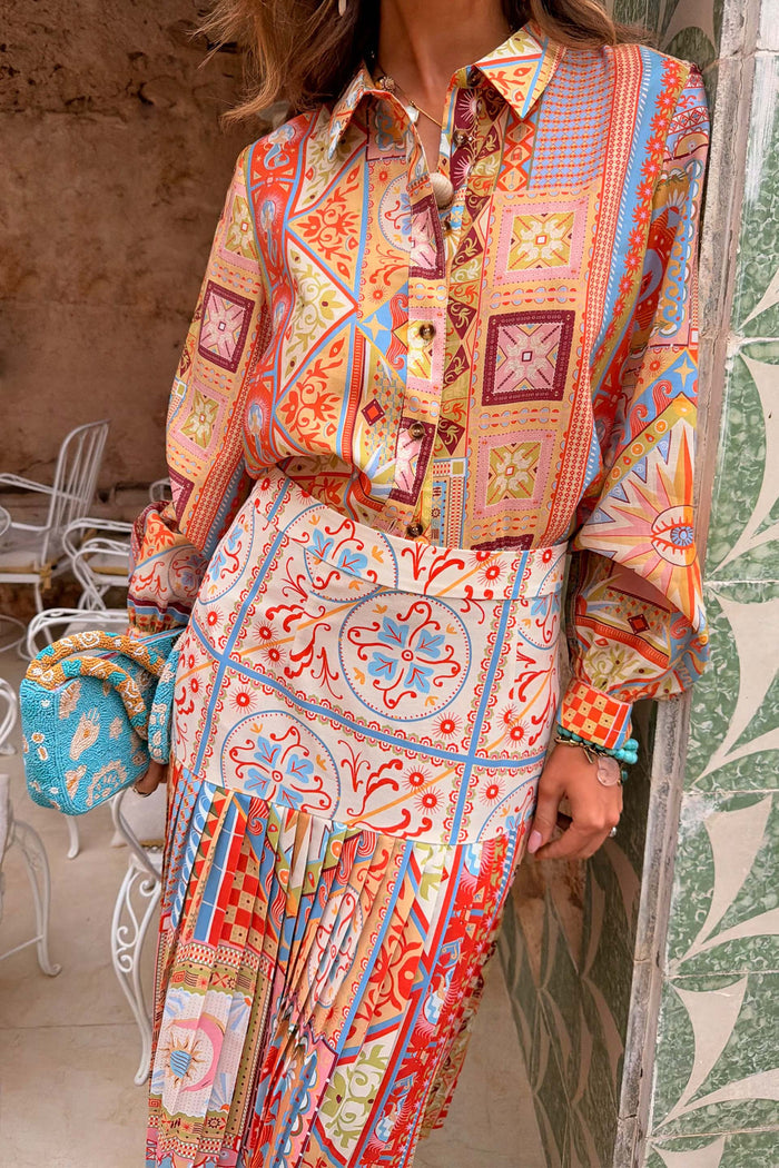 Dolce Vita Freya pleated midi skirt in a tile patchwork print, styled as a co-ord with the matching vacation shirt.