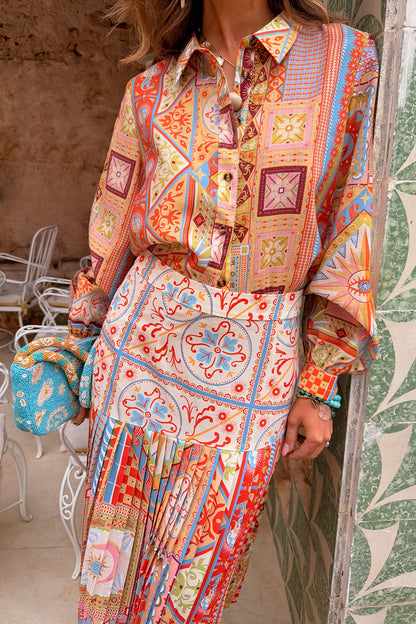 Dolce Vita Freya pleated midi skirt in a tile patchwork print, styled as a co-ord with the matching vacation shirt.