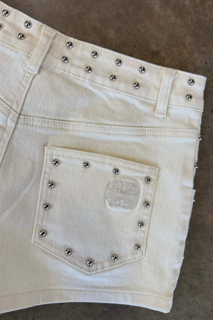 Ecru Studded Hot Pant back pocket detail with silver studs on a cream cotton base and tonal embroidery.