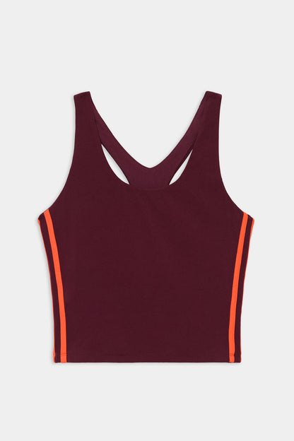 The SPLITS59 Ella Airweight Tank in Dark Cherry/Valencia is a sleeveless racerback crop top with orange side stripes, crafted from a nylon-spandex blend, shown against a white background.
