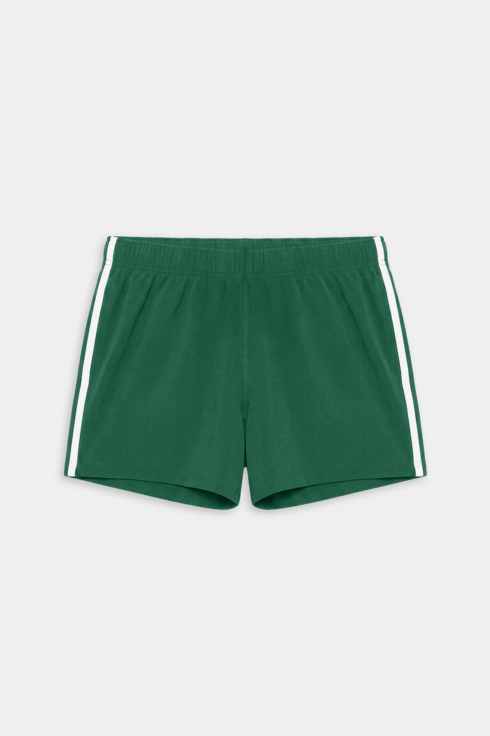 The SPLITS59 Ella Airweight Track Short in Arugula/White features lightweight fabric, white side stripes, and an elastic waistband—ideal for hot yoga or casual workouts. Laid flat on a plain background.