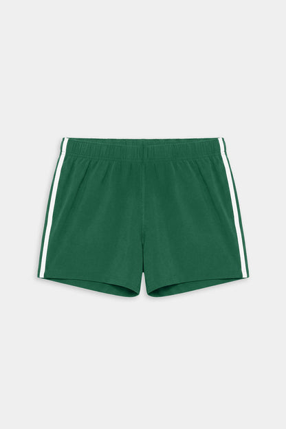 The SPLITS59 Ella Airweight Track Short in Arugula/White features lightweight fabric, white side stripes, and an elastic waistband—ideal for hot yoga or casual workouts. Laid flat on a plain background.