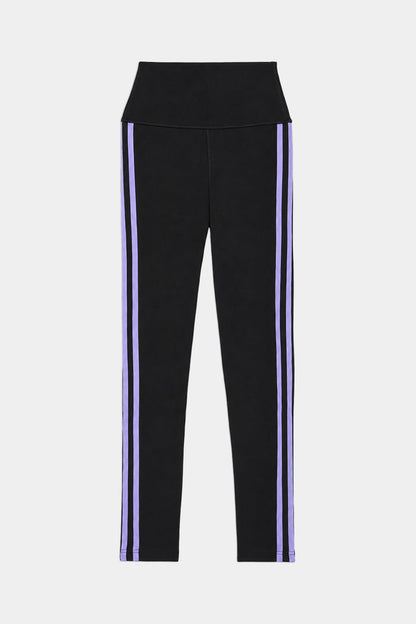 The SPLITS59 Ella High Waist Airweight 7/8 leggings in Black/Purple Haze feature a high waistband and two vertical purple stripes down each leg, shown on a white background.