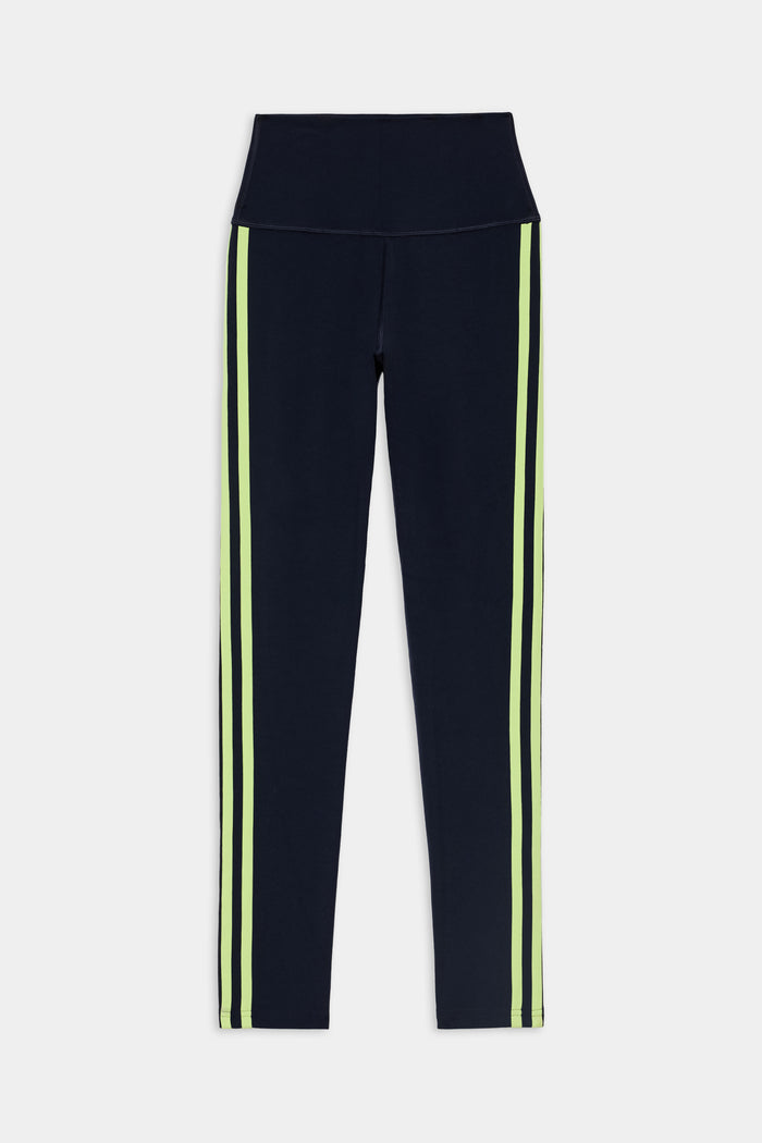 Introducing the SPLITS59 Ella High Waist Airweight 7/8 leggings in Indigo/Limeade—a sleek high-waist design featuring vertical neon limeade stripes along the sides, perfect for hot yoga. Displayed flat on a white background, these leggings effortlessly blend style and performance to support you during your most intense workouts.