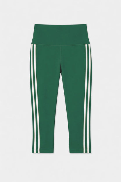 The SPLITS59 Ella High Waist Airweight Capri in Arugula/White features a cropped silhouette, high waistband, and two vertical white side stripes, shown against a plain white background.