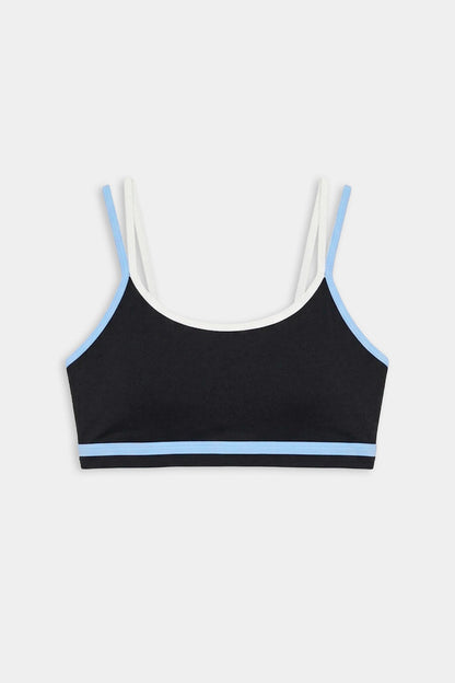 The SPLITS59 Eva Rigor Double Strap Bra in Black/Skylight features blue trim, white shoulder straps, and is shown on a plain white background.