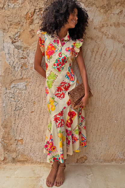 Fruit Stamps Remi Dress in cotton-linen with a fruit sticker print, ruffle sleeves and a tailored button collar.