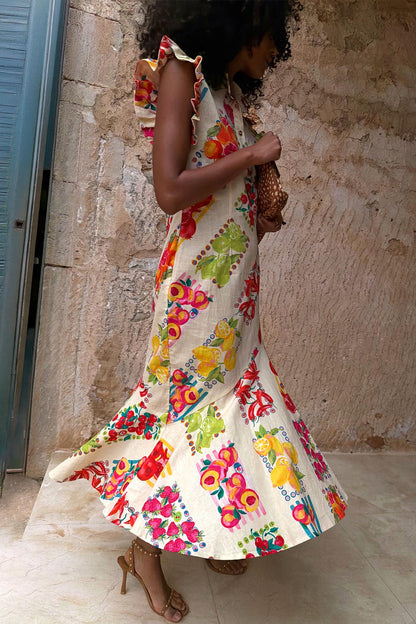 Fruit Stamps Remi Midi Dress in white cotton-linen with ruffle sleeves and a vibrant fruit sticker print.