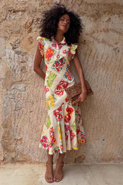 Fruit Stamps Remi Dress in a cotton-linen blend with a bold fruit sticker print and ruffle sleeves.