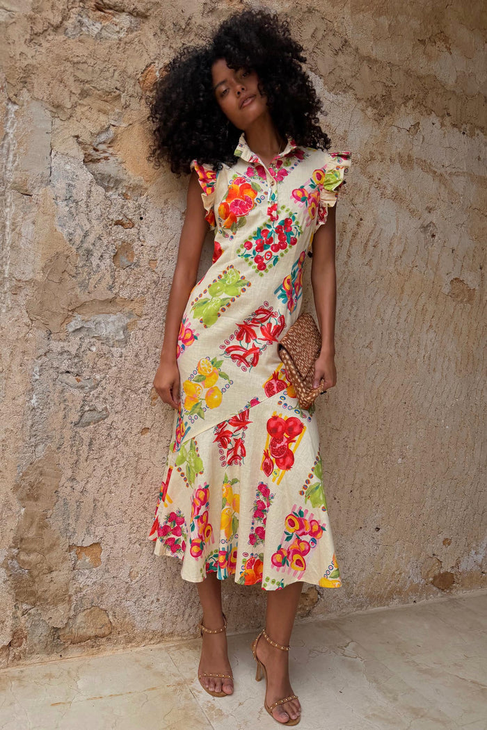 Fruit Stamps Remi midi dress in a cotton-linen blend with a vibrant fruit print, ruffle sleeves and button collar.