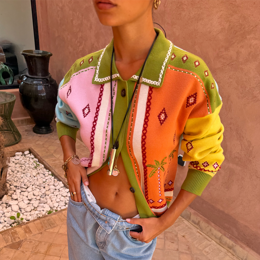 Green Geometric Palm Cardigan with orange and pink panels, palm tree motifs and white blanket stitch detailing.
