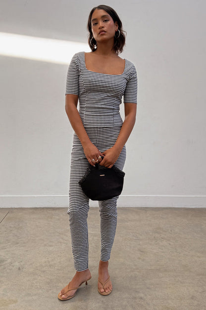 Black and white Gingham Trousers and matching top co-ord featuring a square neckline and skinny leg fit.
