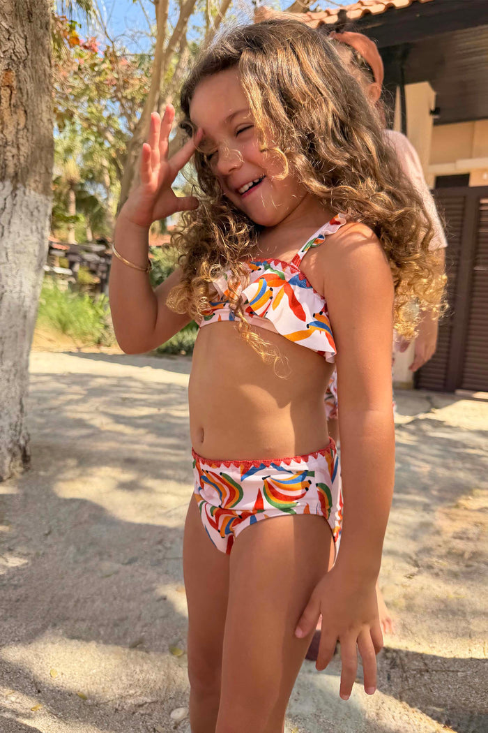 Girl's Banana Bikini in a multicoloured banana print with a frill bandeau top and matching bottoms.