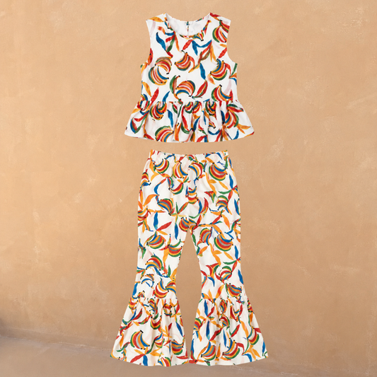 Multicoloured banana print cotton co-ord with a sleeveless peplum top and matching flared trousers.