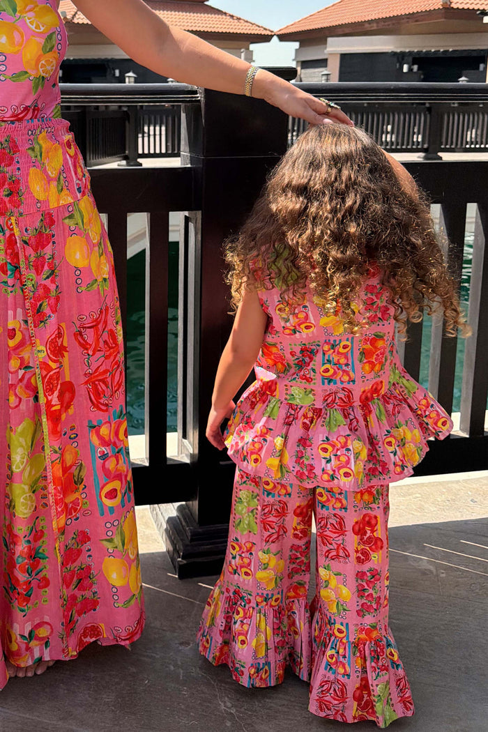 NFD Kids Pink Fruit Wide Leg Set in cotton, with a peplum top and frilled trousers in a Mediterranean-inspired print.