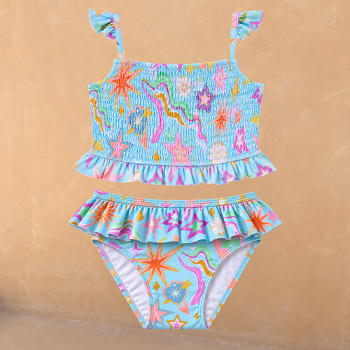 Blue Girl's Starburst Crop Bikini Set featuring a smocked top with frill straps and matching ruffle-trim bottoms.
