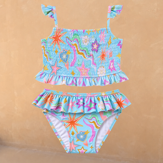 Blue Girl's Starburst Crop Bikini Set featuring a smocked top with frill straps and matching ruffle-trim bottoms.
