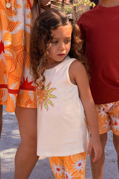 Girl's Yellow Sun Cotton Set featuring a sequined soleil motif vest and flared sun print trousers.