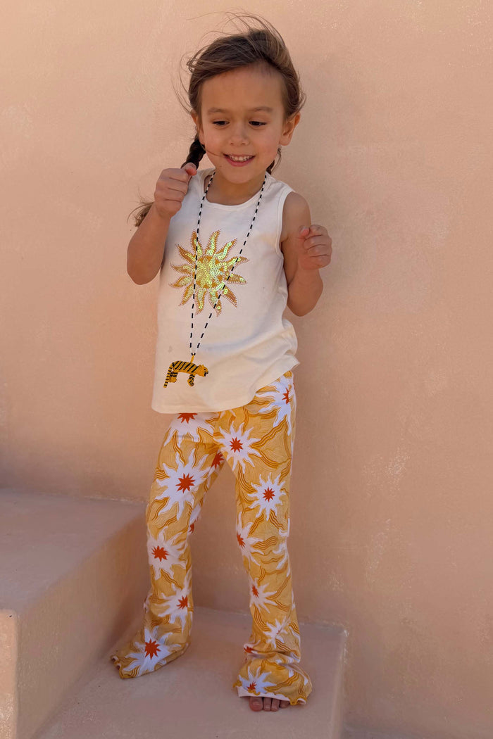 Girl's Yellow Sun Cotton Set with a cream sequined sun vest and flared trousers in an iconic soleil sun print.