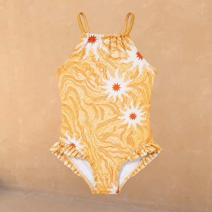 Girl's yellow sun print swimsuit featuring a high neck, thin straps and frill detailing at the leg.