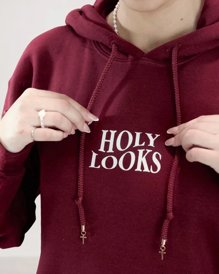 Maroon hoodie with 'HOLY LOOKS' text on a plain background
