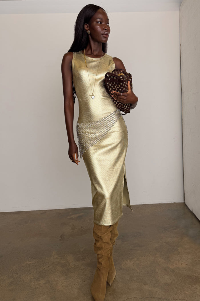 Gold Metallic Ribbed midi dress with a sleeveless design and side slit, styled with slouchy boots.