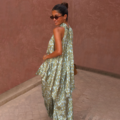 Green Diamond Print Halter Top in olive satin with a draped scarf detail, worn as a co-ord with matching trousers.