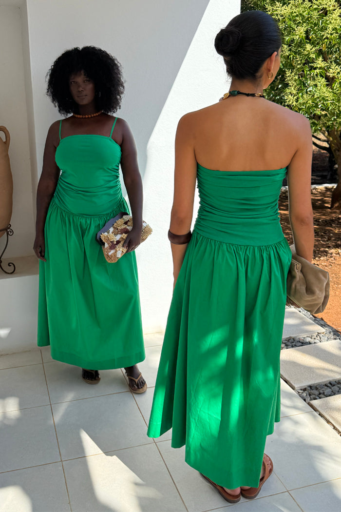 Green Lola Mid-axi Cotton Dress with a ruched bodice and full skirt, shown on two models for inclusive sizing.