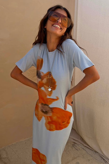 Ice Blue Floral Rib Dress featuring a large orange floral print on soft stretch ribbed fabric.