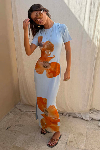 Ice Blue Floral Rib Dress with bold orange flower prints, a ribbed stretch fabric and maxi silhouette.