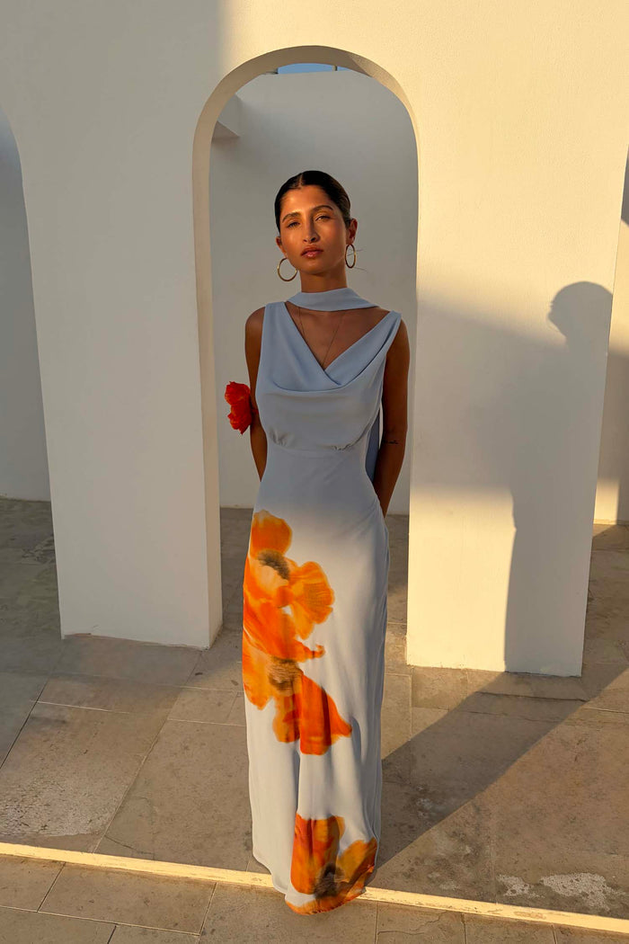 Ice Blue Floral Sophie Dress featuring a drape neckline, large orange floral print and a multi-wear neck scarf.
