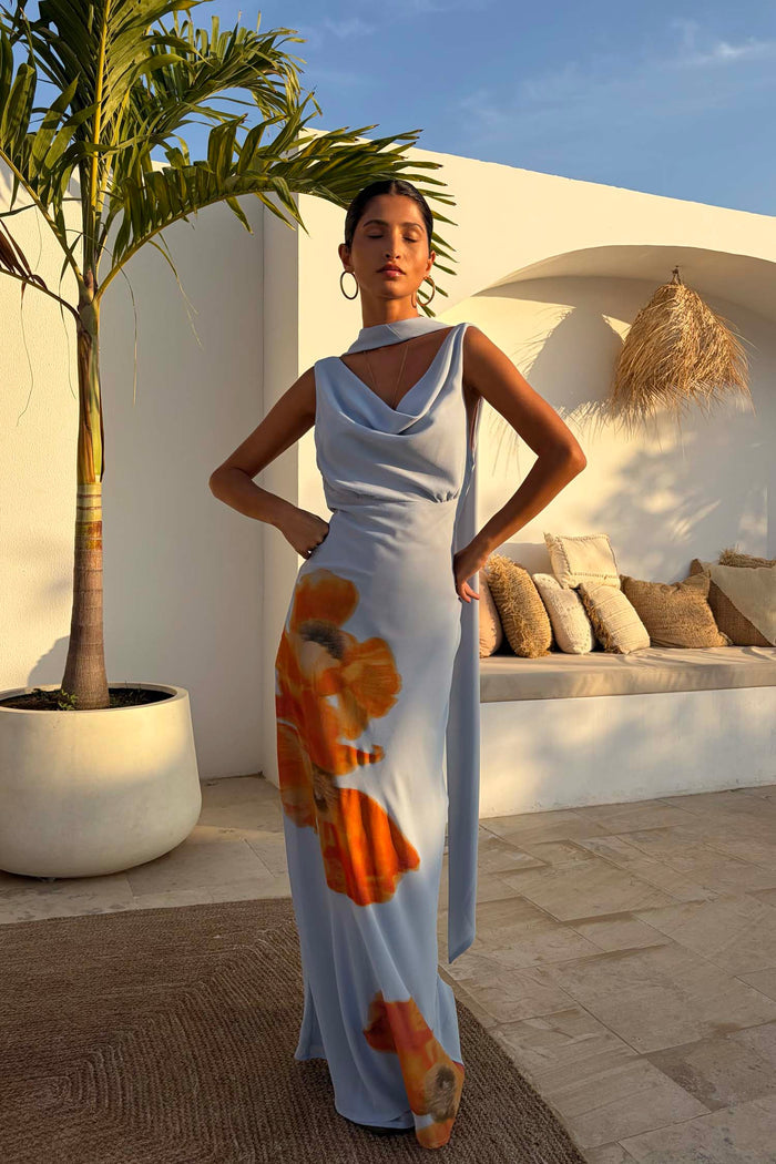 Ice Blue Floral Sophie Dress with a draped neckline, orange floral print and trailing multi-wear scarf detail.
