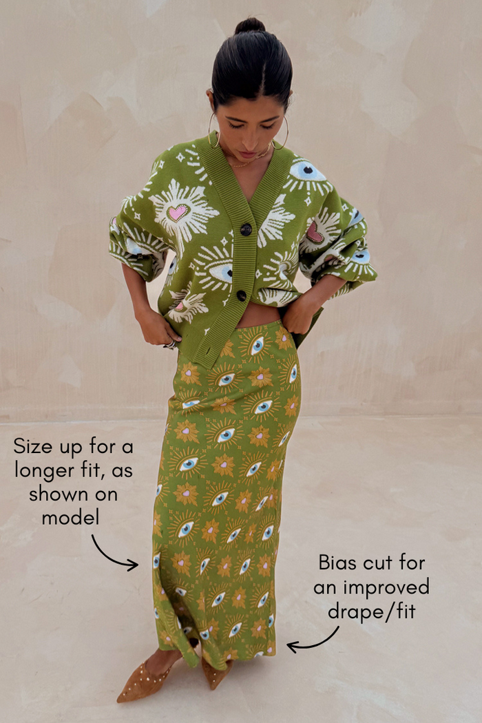 Khaki Eye Dorris Skirt and matching cardigan with eye motifs, shown in size 10 on a size 6 model for a longer fit.