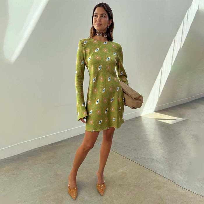 Khaki Eye Mini Soho Dress in green featuring the iconic NFD eye print, flared sleeves, and an hourglass silhouette.