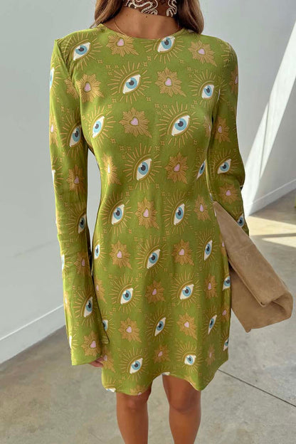 Iconic Khaki Eye Mini Soho Dress featuring a green eye print, flared sleeves and an hourglass silhouette.