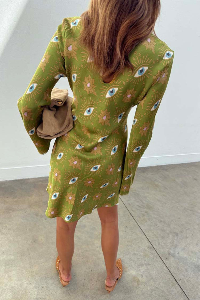 Khaki Eye Mini Soho Dress with the iconic eye print, flared sleeves and a back keyhole button fastening.