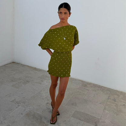 Iconic Khaki Mini Plisse Tilly Dress featuring a gold fleck shimmer and stretchy textured fabric.