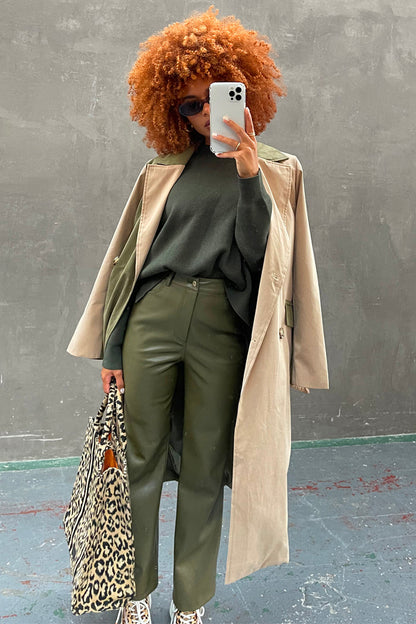 Khaki Vegan Leather Trousers paired with a beige trench coat and leopard print bag for a London look.