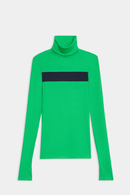 The SPLITS59 Lennon Rib Turtleneck in Grass/Indigo features bright green ribbing and a navy chest stripe—ideal for yoga or running, shown laid flat on a white background.