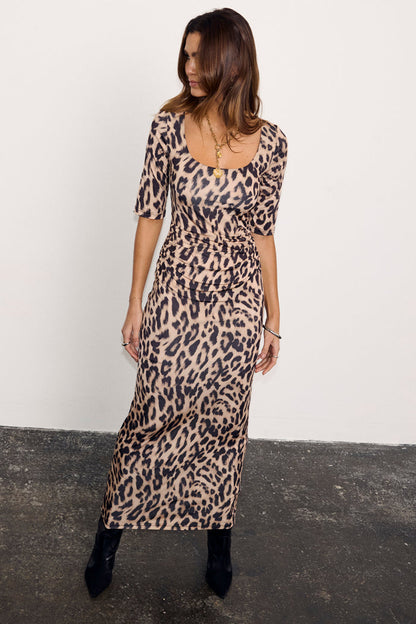 Leopard Iris Dress with elbow-length sleeves and waist ruching, a statement staple for any occasion.