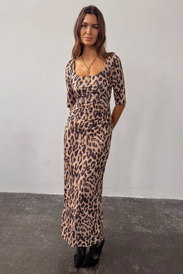 Leopard Iris Dress in iconic animal print with ruched waist detailing and a simple midi silhouette.