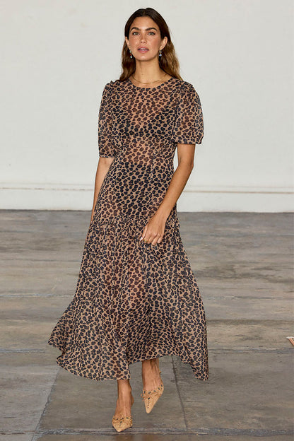 Leopard Lucia Dress featuring a sheer leopard print, voluminous puff sleeves and a tiered drop waist.